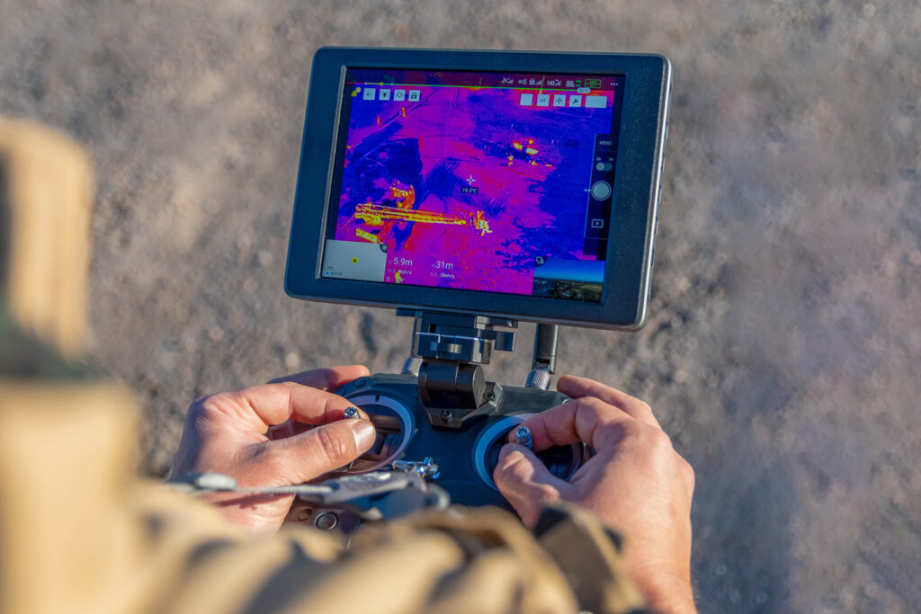 A closeup shot of a firefighter flying drone with thermal camera